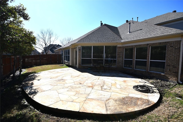 rear view of property featuring a patio