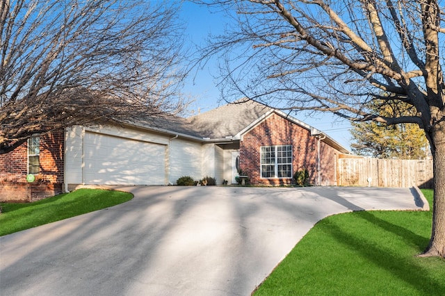 view of front of house with a garage and a front yard