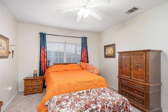 bedroom with light carpet and ceiling fan