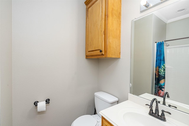 bathroom with ornamental molding, vanity, toilet, and a shower with shower curtain