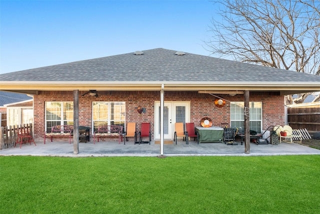 back of house featuring a yard and a patio area