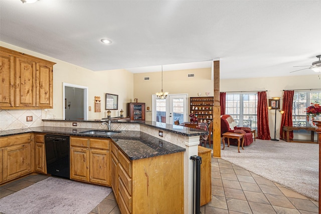 kitchen featuring sink, hanging light fixtures, black dishwasher, light colored carpet, and kitchen peninsula