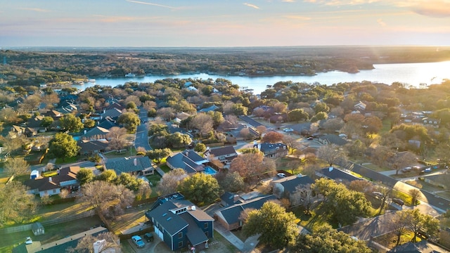 aerial view at dusk with a water view