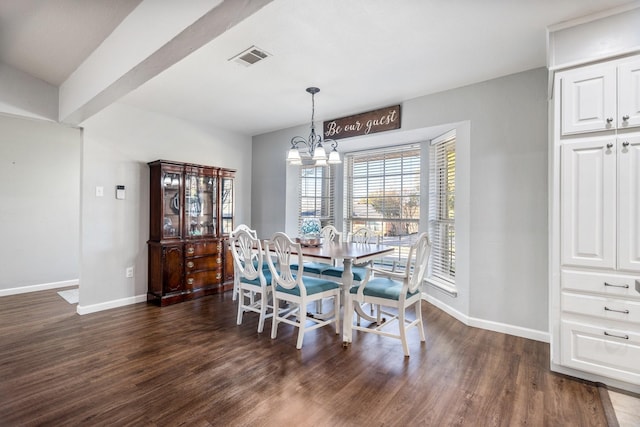 dining room with beamed ceiling, dark hardwood / wood-style floors, and an inviting chandelier