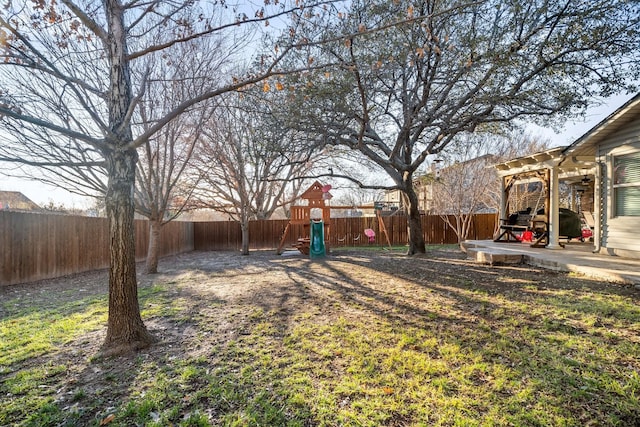 view of yard with a playground and a patio area