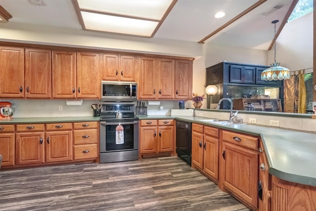 kitchen with pendant lighting, sink, tasteful backsplash, and stainless steel appliances