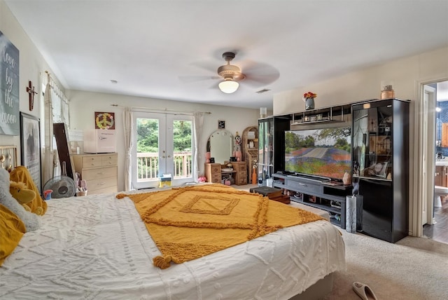 bedroom with french doors, black refrigerator, carpet floors, ceiling fan, and access to exterior