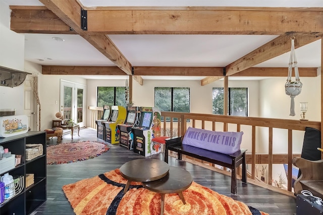 sitting room featuring beam ceiling and dark wood-type flooring