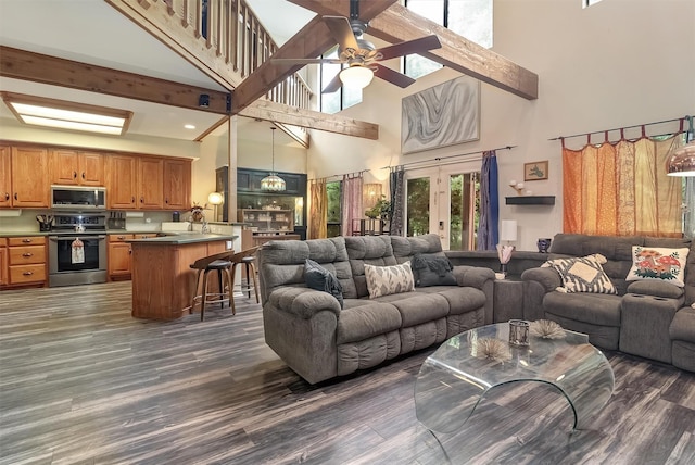 living room featuring sink, dark wood-type flooring, french doors, and ceiling fan