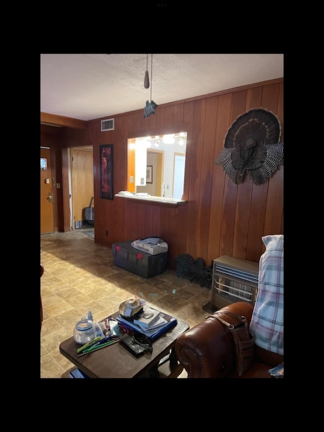 interior space featuring wood walls