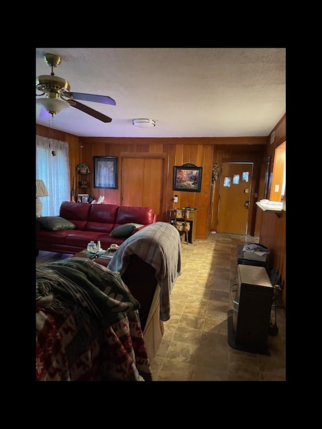 bedroom featuring wood walls