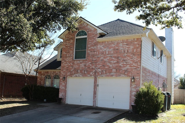 view of property exterior featuring brick siding, a chimney, a shingled roof, concrete driveway, and a garage