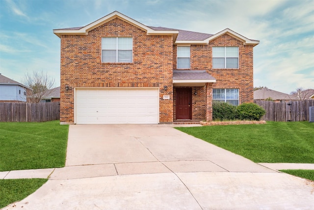 front facade featuring a garage and a front lawn