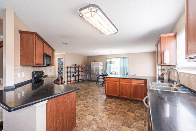 713 Devontree Ct, Fort Worth, TX 76052 - kitchen featuring a peninsula, brown cabinets, tasteful backsplash, a sink, and black appliances