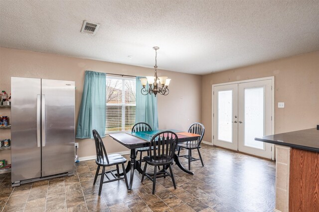 713 Devontree Ct, Fort Worth, TX 76052 - dining room featuring baseboards, visible vents, french doors, and a chandelier