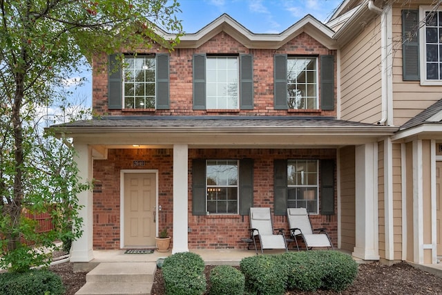 doorway to property featuring a porch