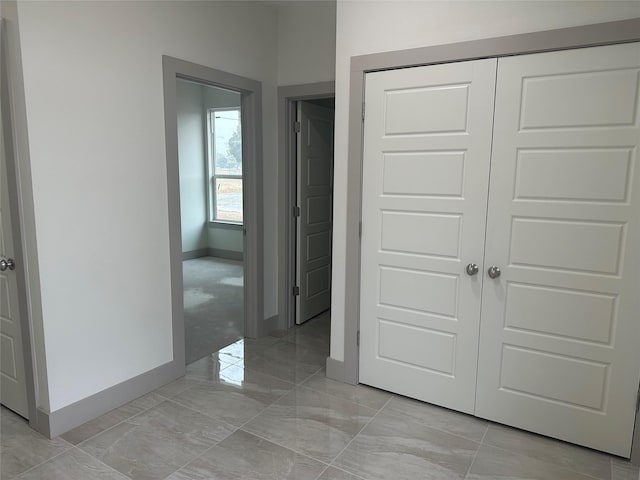 unfurnished bedroom featuring a closet