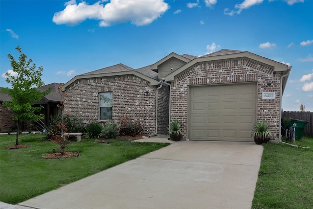 single story home with a garage and a front lawn