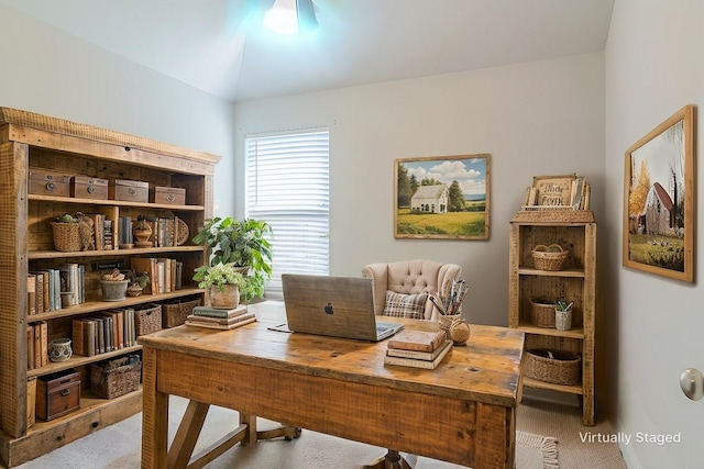 office featuring lofted ceiling and carpet flooring