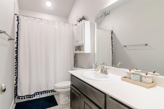 bathroom featuring tile patterned flooring, vanity, and toilet