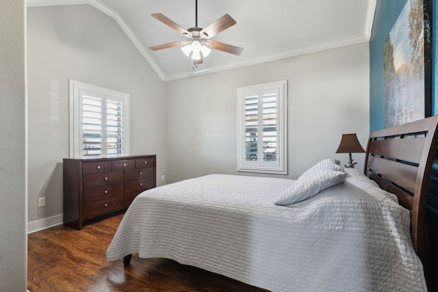 bedroom featuring lofted ceiling, dark wood-type flooring, ornamental molding, and ceiling fan