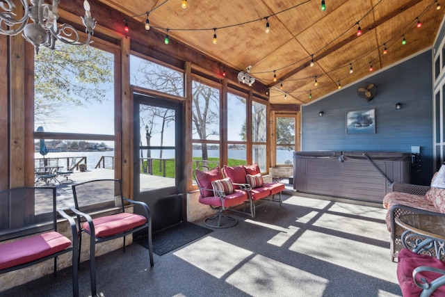 sunroom featuring vaulted ceiling, a water view, wood ceiling, and rail lighting