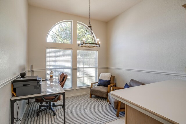 home office with an inviting chandelier and plenty of natural light