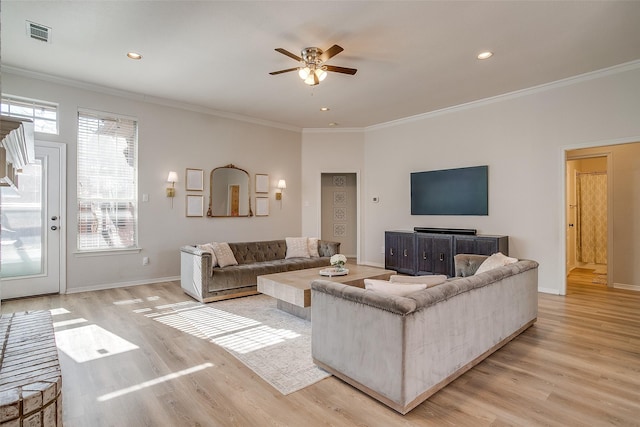 living room with ceiling fan, ornamental molding, and light hardwood / wood-style floors