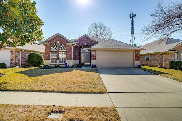 ranch-style house with a garage and a front lawn