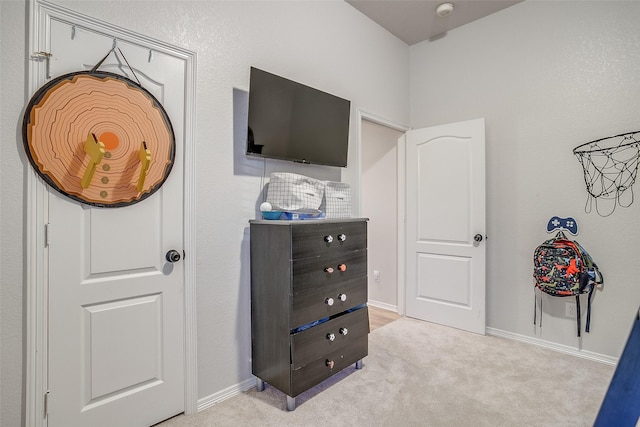 bedroom with light colored carpet