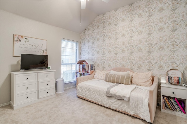 bedroom featuring ceiling fan, light colored carpet, and lofted ceiling