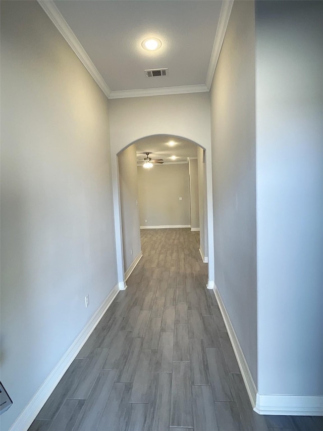 corridor featuring hardwood / wood-style floors and ornamental molding