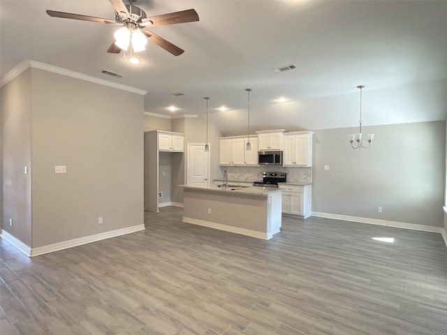 kitchen featuring sink, white cabinetry, hanging light fixtures, a center island with sink, and appliances with stainless steel finishes