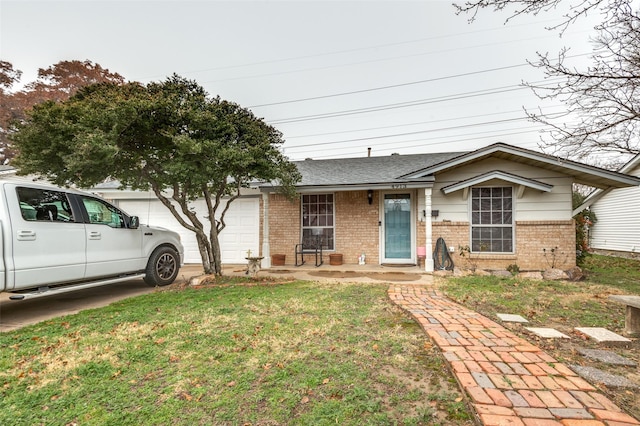 view of front of property with a garage and a front yard