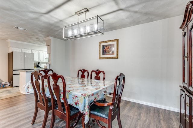 dining space with dark wood-type flooring