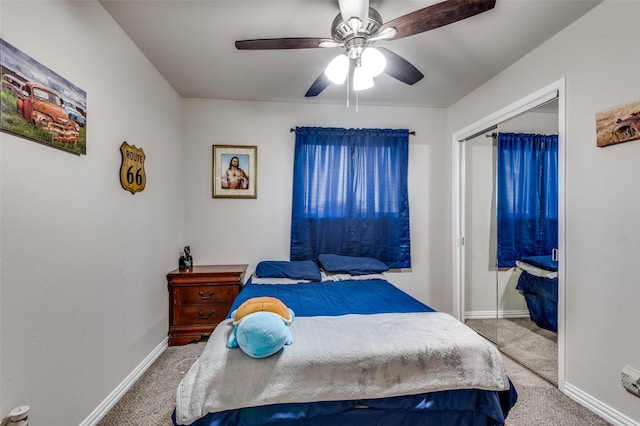 carpeted bedroom featuring a closet and ceiling fan