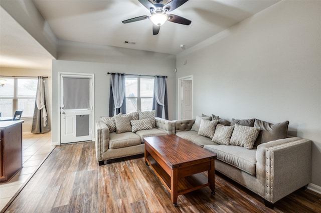 living room featuring ceiling fan and light wood-type flooring