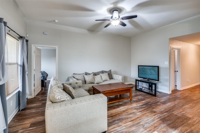 living room featuring dark hardwood / wood-style flooring and ceiling fan