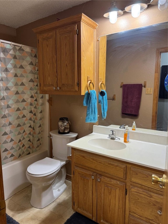 full bathroom featuring shower / tub combo with curtain, tile patterned floors, toilet, a textured ceiling, and vanity