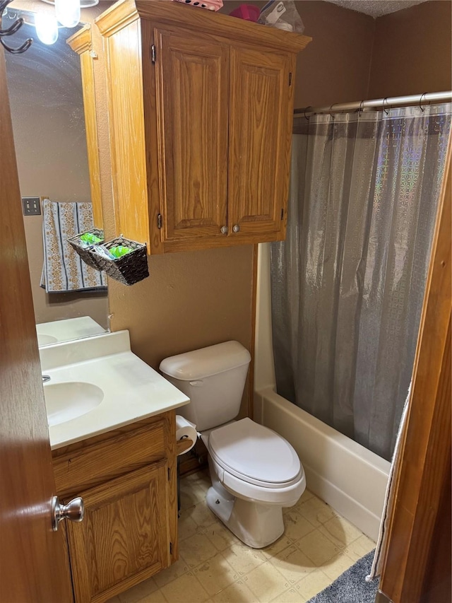 full bathroom featuring vanity, shower / bath combination with curtain, and toilet