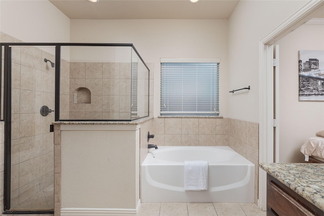 bathroom with vanity, tile patterned floors, and separate shower and tub