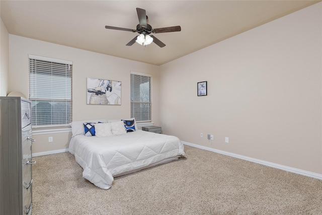 bedroom featuring ceiling fan and light carpet