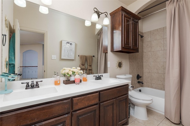 full bathroom with tile patterned floors, toilet, shower / tub combo, and vanity