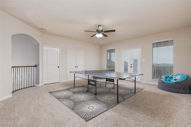 playroom featuring carpet floors, french doors, ceiling fan, and plenty of natural light