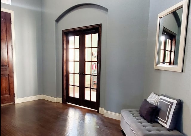 entryway featuring dark hardwood / wood-style flooring and french doors