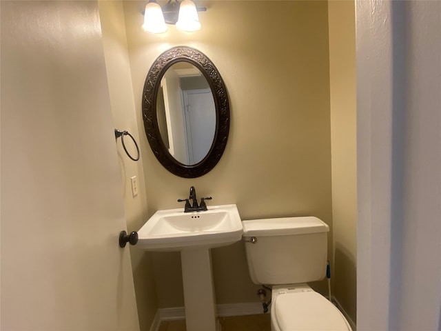 bathroom with sink and toilet