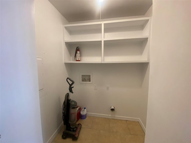 laundry room with electric dryer hookup, washer hookup, and tile patterned floors