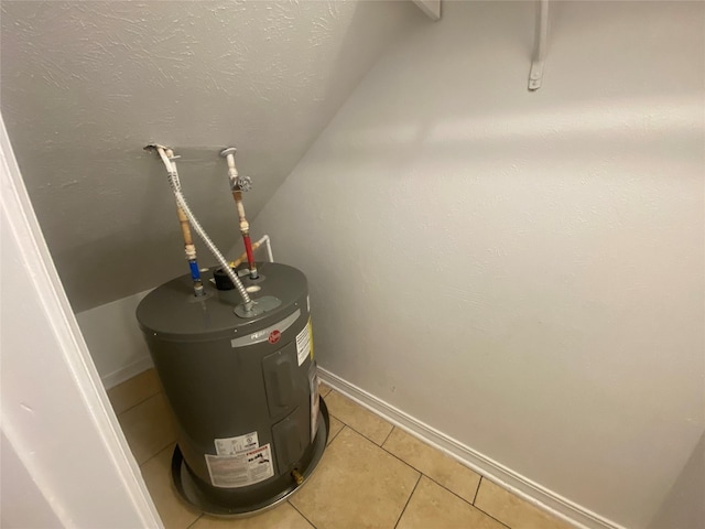 utility room featuring electric water heater