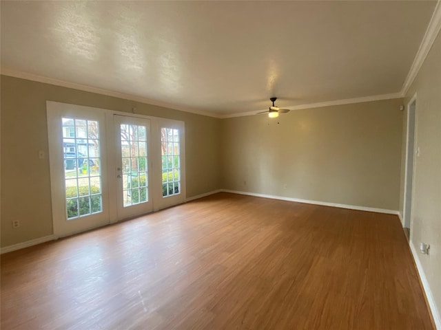 unfurnished room featuring crown molding, hardwood / wood-style flooring, and ceiling fan