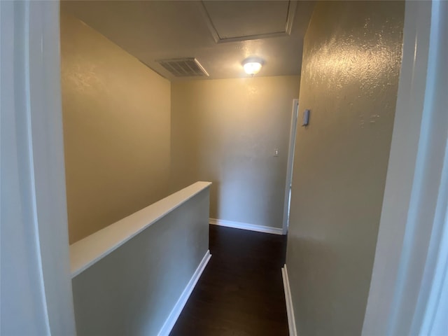 hall with dark hardwood / wood-style flooring